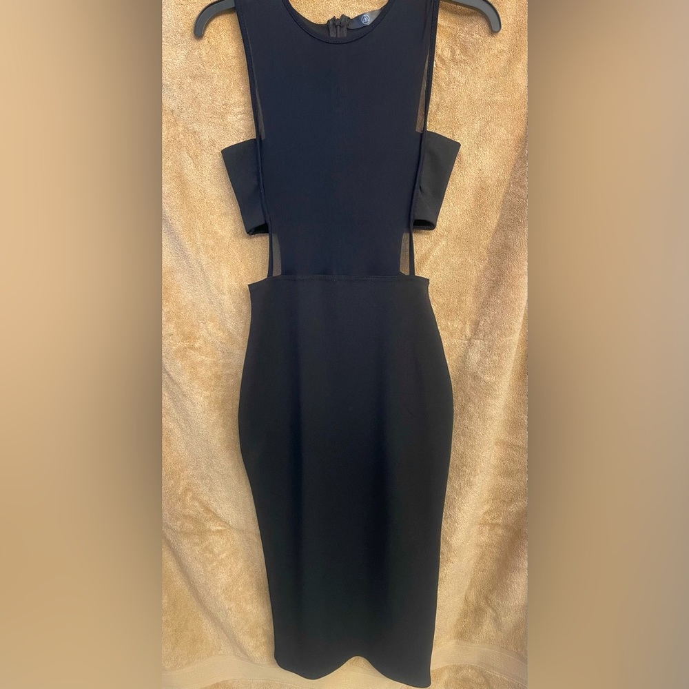 Black small dress with sheer too with a black bandeau across the bust.